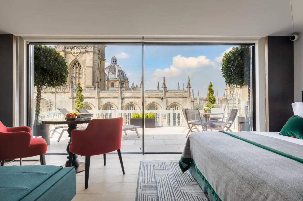 a bedroom with a view of a building at Old Bank Hotel in Oxford